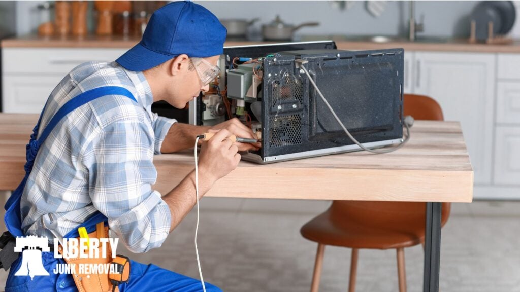 an expert repairing a microwave oven